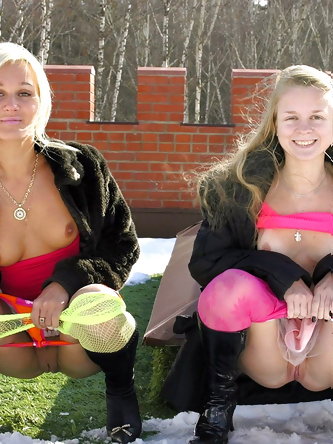 Young lesbians peels off hose and skirts before...
